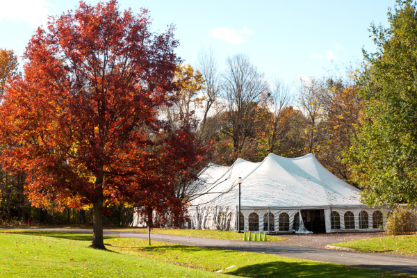 A white tent set up outside on a clear day